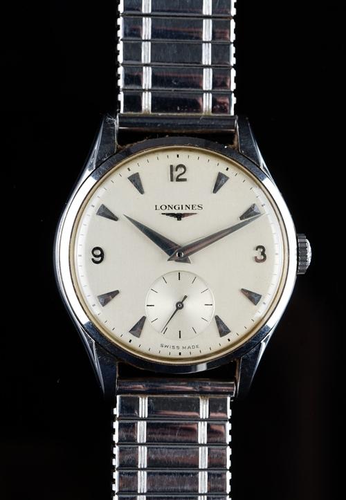 A Longines steel cased gentleman's wristwatch, the signed silvered dial with silvered Arabic and triangular numerals and with subsidiary seconds, on a