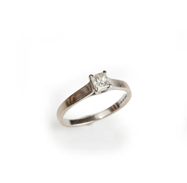 An 18ct white gold ring, claw set with a princess cut diamond, ring size M and a half, gross weight 2.8 gms.