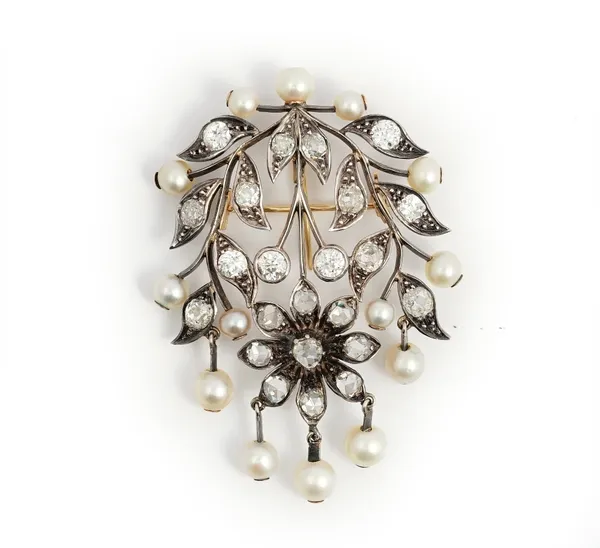 A gold backed and silver set diamond and cultured pearl pendant brooch, second half of the 19th century, in a floral and twin spray design, mounted wi