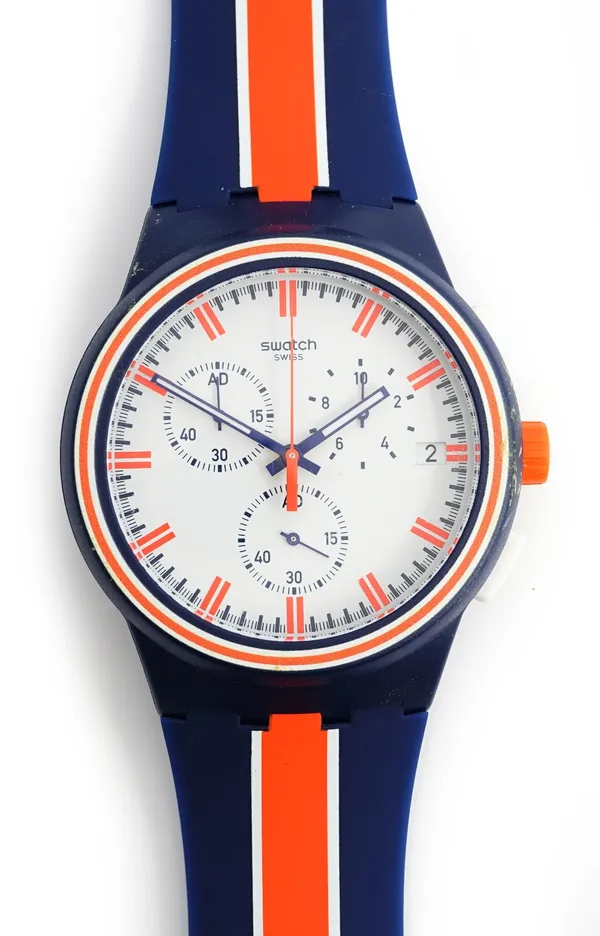 A Swatch Swiss blue, orange and white plastic wristwatch, the signed white dial with three subsidiary dials and with centre stop seconds, with a plast