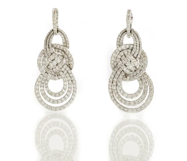 A pair of white gold and diamond set pendant earrings, each in a graduated openwork looped design, mounted with circular cut diamonds, detailed 750, t