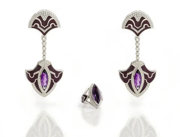 A white gold, diamond, amethyst and mauve enamelled pair of pendant earrings and a matching ring, each piece mounted with a marquise shaped amethyst,