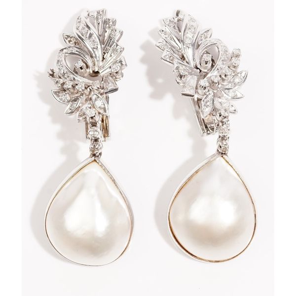 A pair of mabé cultured pearl and diamond-set pendent earrings, the floral spray earclips set throughout with circular-cut diamonds, suspending two di