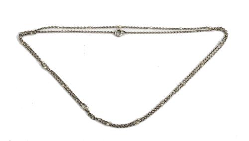 A platinum and seed pearl necklace, the oval link platinum chain spaced with seed pearls at intervals, on a bolt ring clasp, length 78cm, gross weight