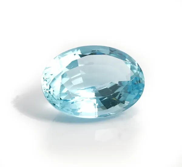 An unmounted oval cut aquamarine, weight approximately 15cts, displayed in a box.