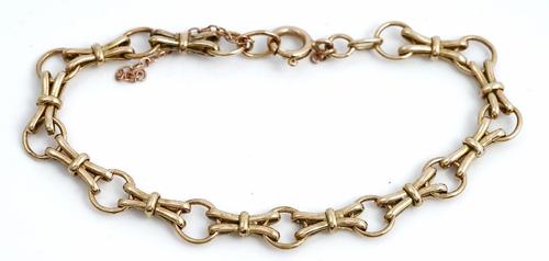 A 9ct gold bracelet in a circular and twin bar link design, on a boltring clasp, length 18.5cm, weight 8.9gms.