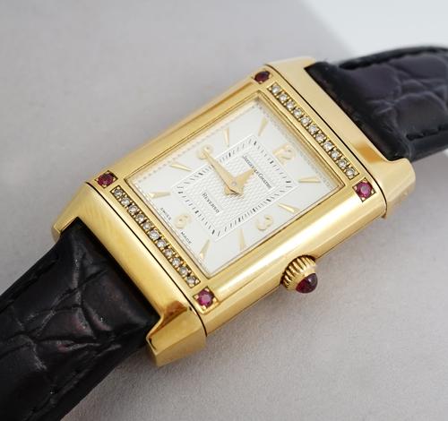 A Jaeger-Le Coultre Reverso 18ct gold, diamond and ruby set dress wristwatch, the signed silvered dial with gilt Arabic and baton numerals and gilt ha