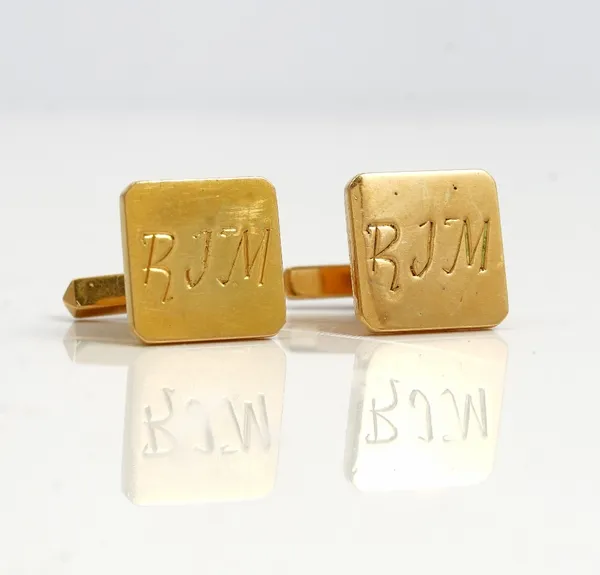 A pair of gold cufflinks, the square fronts initial engraved, the backs with folding sprung bar fittings detailed 18 K, gross weight 10 gms.