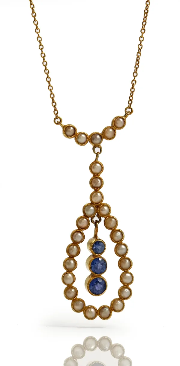 A gold, sapphire and half pearl set pendant necklace, early 20th century, the swing centre collet set with a row of three graduated cushion shaped sap