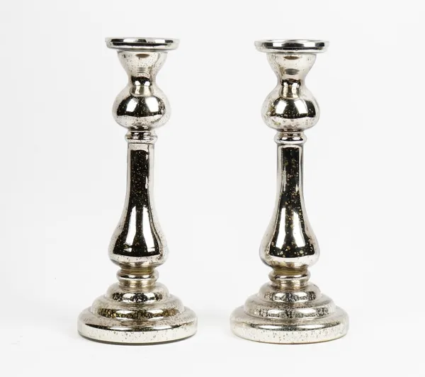 A pair of mercurial glass candlesticks. 39cm high x 16cm wide