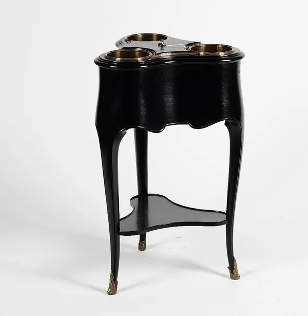 A French ebonised electroplate mounted champagne cooler, circa 1920's, for three bottles, with lift out liners, on cabriole legs, 45cm wide x 74cm hig