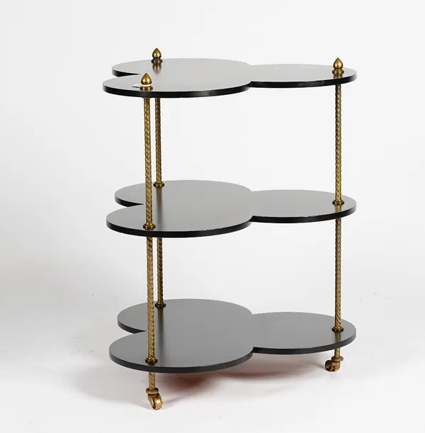 An ebonised and gilt metal clover-leaf shape three tier table, 56cm wide x 69cm high.