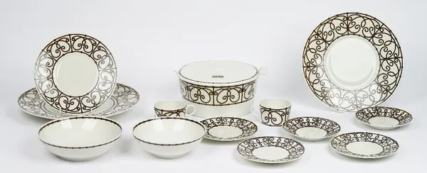 A Limoges J L Coquet tea and dinner service, essentially for eight persons, and with various serving dishes (qty).