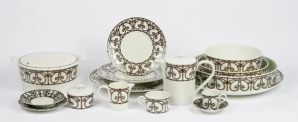 A Limoges J L Coquet tea and dinner service, essentially for eight persons, with various serving dishes and four additional coffee cups (qty).