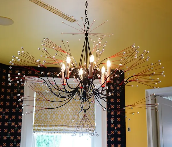 A contemporary six light black and red wire work light fitting, with spherical terminals.115cm tall x 140cm wide