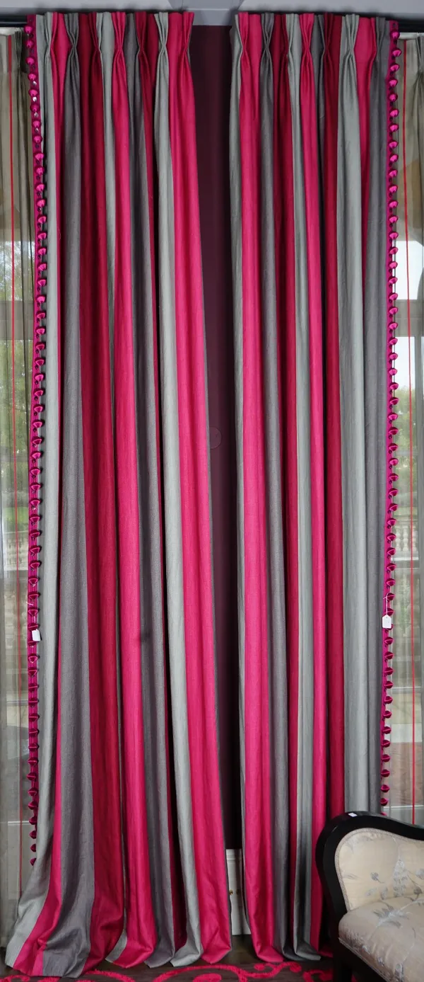 A pair of grey and magenta striped linen curtains trimmed with tassels. 90cm wide x 310cm long.