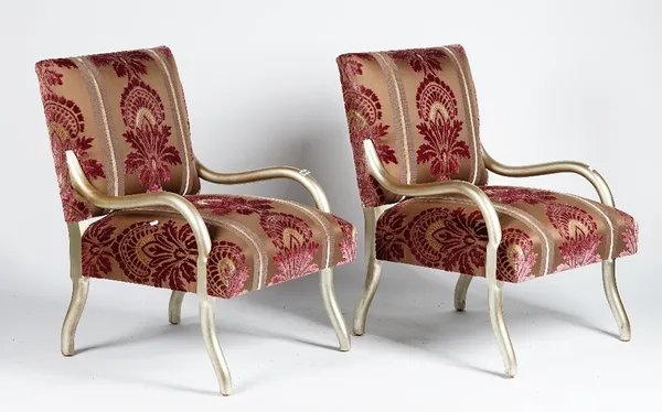 A pair of Rockefeller chairs, mid century, with silvered frames, upholstered in brown and purple cut velvet, 66cm wide x 89cm high.
