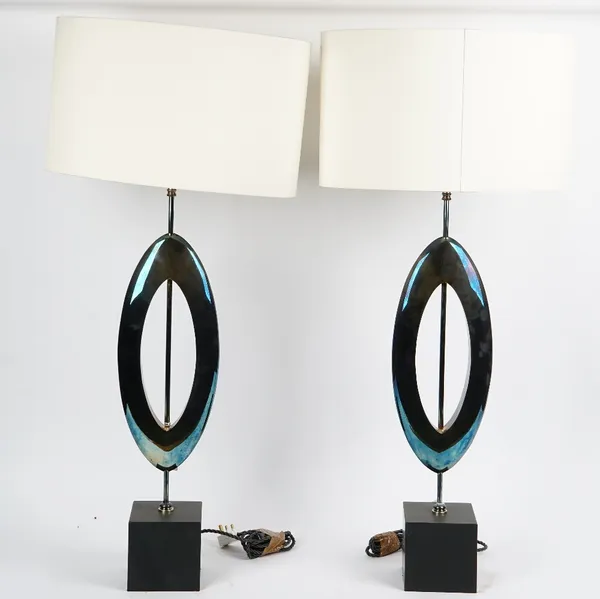 A pair of Manhattan sculpted table lamps, with oval silk shades (2).76cm tall without shades x 18cm wide