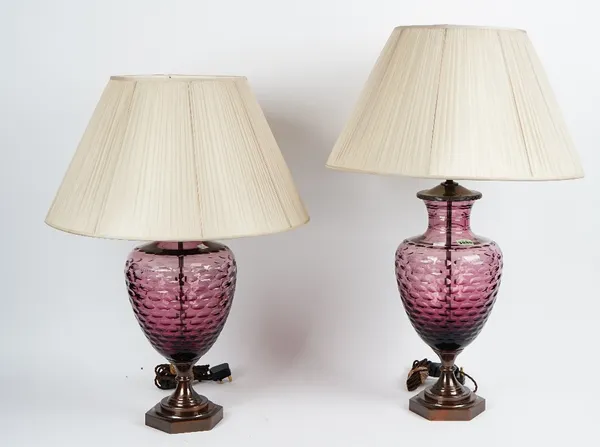 A pair of facet cut amethyst glass table lamps, with bronzed mounts and pleated shades (2).80cm high x 21cm wide