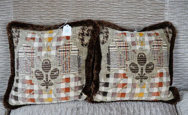 A pair of cushions in abstract check pattern material (2).