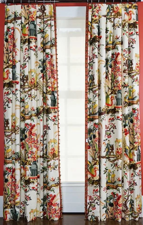 A pair of cream linen fabric curtains, with multicoloured bird and Chinese pattern, in 18th century style, trimmed with bobble bands.170cm wide x 300c