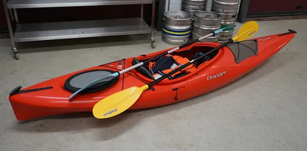 A Dagger Axis Elite 10.5 red kayak.