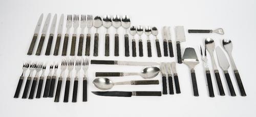 A Sabre, Paris, 18/10; a stainless steel canteen of flatware and cutlery, with black oval section handles (qty).