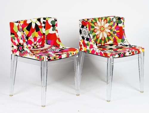 A pair of Madamoiselle chairs by Kartell, with clear lucite frames and upholstered in colourful Missoni floral upholstery, 52cm wide x 75cm high, (2).