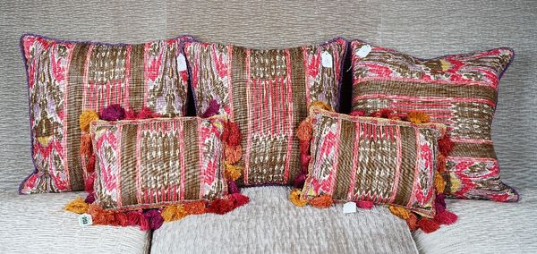 A set of three scatter cushions and another pair with tasseled borders (5).