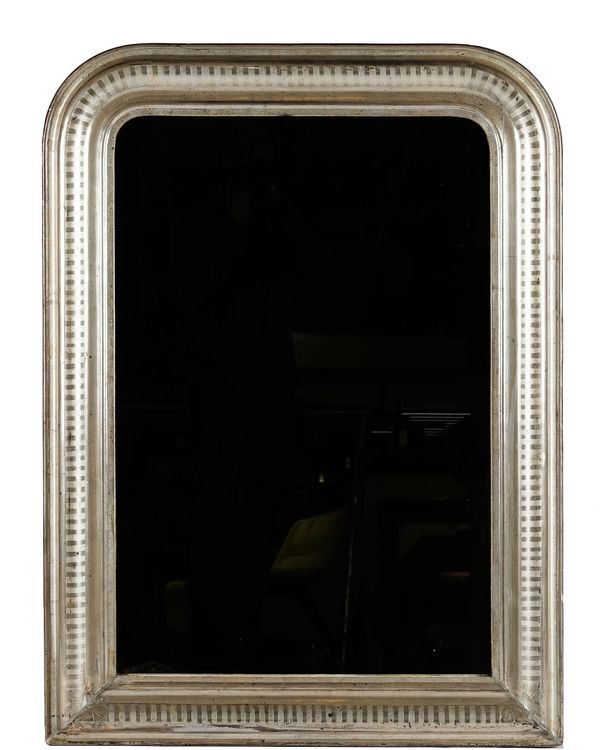 An arched top mirror in moulded distressed silvered wood frame, 76cm wide x 104cm high.