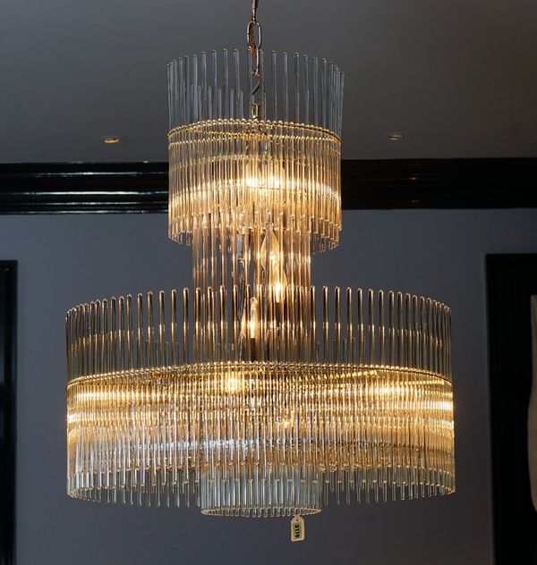 A contemporary glass and gilt metal frame chandelier, hung with tubular drops, 80cm drop.