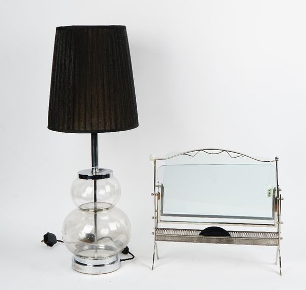 A chromium frame magazine rack with plate glass sides, and a glass chromium mounted double gourd table lamp, with pleated black shade (2).