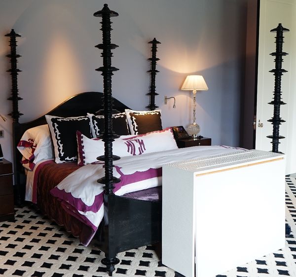 An American ebonised Ferret bed, with arched headboard and four ring turned columns, 220cm wide, with a Stearns & Foster mattress.