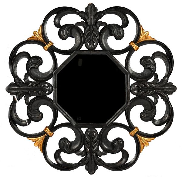 A Remi Dubois mirror, the ebonised frame elaborately carved with leaves and scrolls and with gilt highlights, 43cm wide x 44cm high.