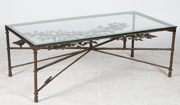 A four piece bronze loggia suite, the rustic frames surmounted by birds and squirrels, with slatted backs and seats, loose cushions, the low table wit