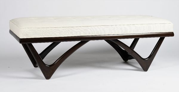 A contemporary rectangular bench, with curved support, button-down upholstered in white linen, 139cm wide x 45cm high.