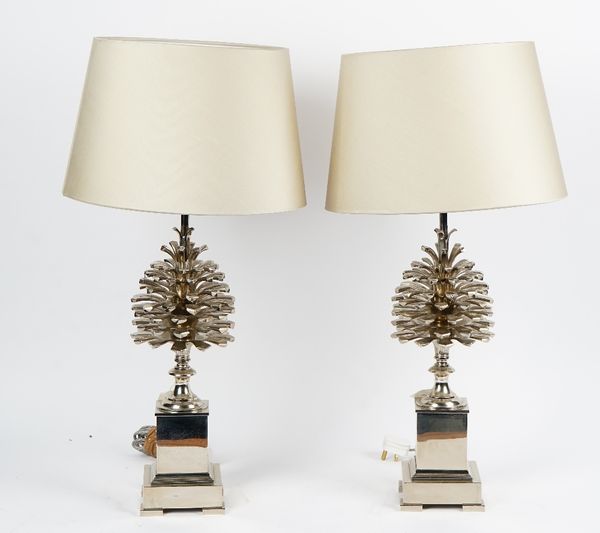 A pair of nickel plated pineapple top table lamps, with cream silk shades.60cm high