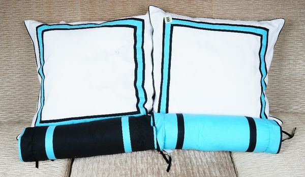 A set of four white cushions, with blue and black bands and four corresponding bolsters (8).