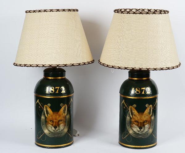 A pair of toile peintre tea canisters, printed with fox masks, horse shoes and riding crops, '1872', with shades, 48cm high excluding shades, (2).