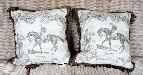 A pair of toile de jouy cushions, printed with vintage horse racing 'Gladiator' scenes, with tasselled edges.