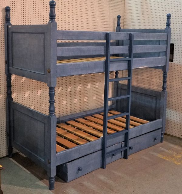 A set of bunk-beds, painted in blue with turned finials, 102cm wide x 192cm high.