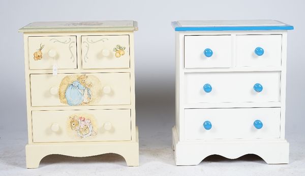 A child's white and blue painted chest of four drawers, another painted with Beatrix Potter figures, a white painted three drawer dressing table and a