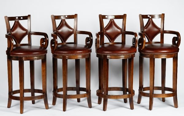 A set of four bar stools with curved leather upholstered backs and circular seats, 49cm wide x 111cm high, (4).