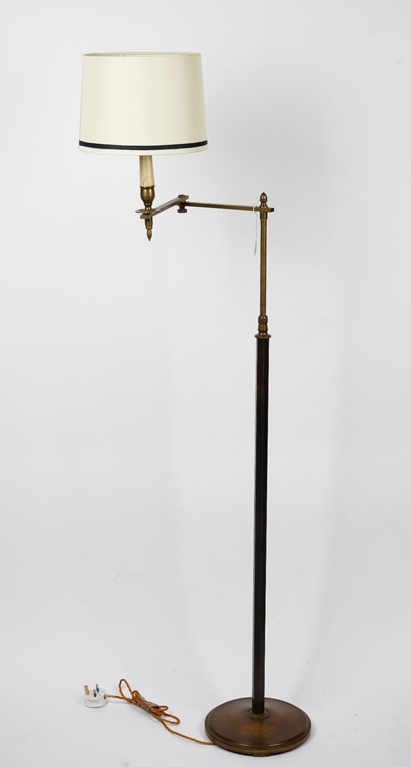 A brass floor standing adjustable lamp, 122cm high.