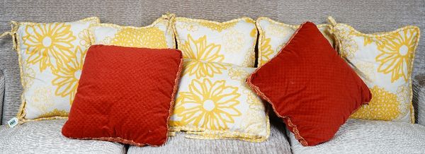 Six cushions upholstered in yellow floral material, four others with multicoloured stripes and a pair of rust velour cushions (12).