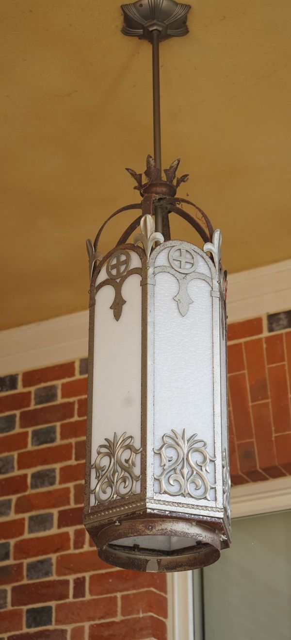 A pair of hexagonal lanterns, the wrought silvered metal frames with white opaline panels (2), 131cm high x 32m wide.