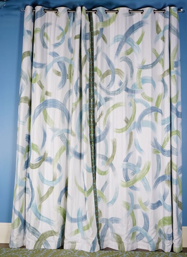 A pair of printed linen curtains, in abstract design. 190cm wide x 310cm long.