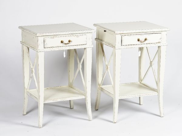 A pair of bedside tables, with distressed white painted finish, each with a drawer, 50cm wide x 76cm high, (2).