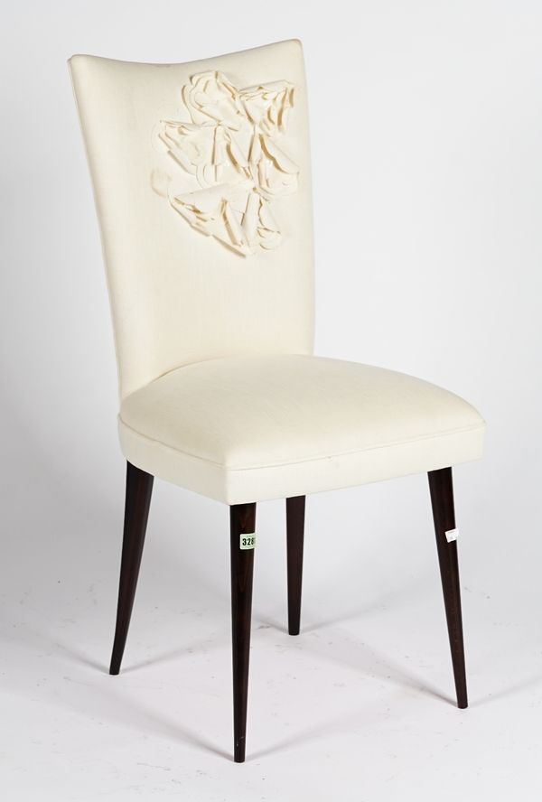 A side chair, upholstered in linen and applied with hand-cut corsages, on round tapering legs, 48cm wide x 94cm high.