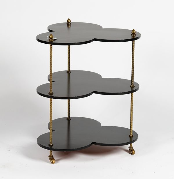 A French ebonised three-tier table, of clover-leaf shape, with gilt metal supports, 55cm wide x 70cm high.